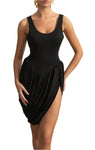 Woman wearing a black sleeveless dress with a slit in a decorative room.