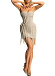 Beige strapless dress with fringe details on a white background