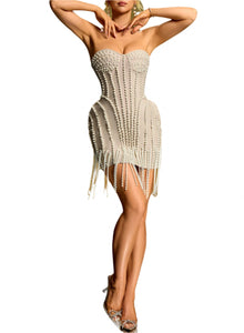 Beige strapless dress with fringe details on a white background