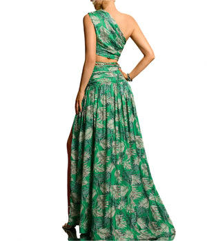 Woman wearing a green floral dress with a yellow gradient background