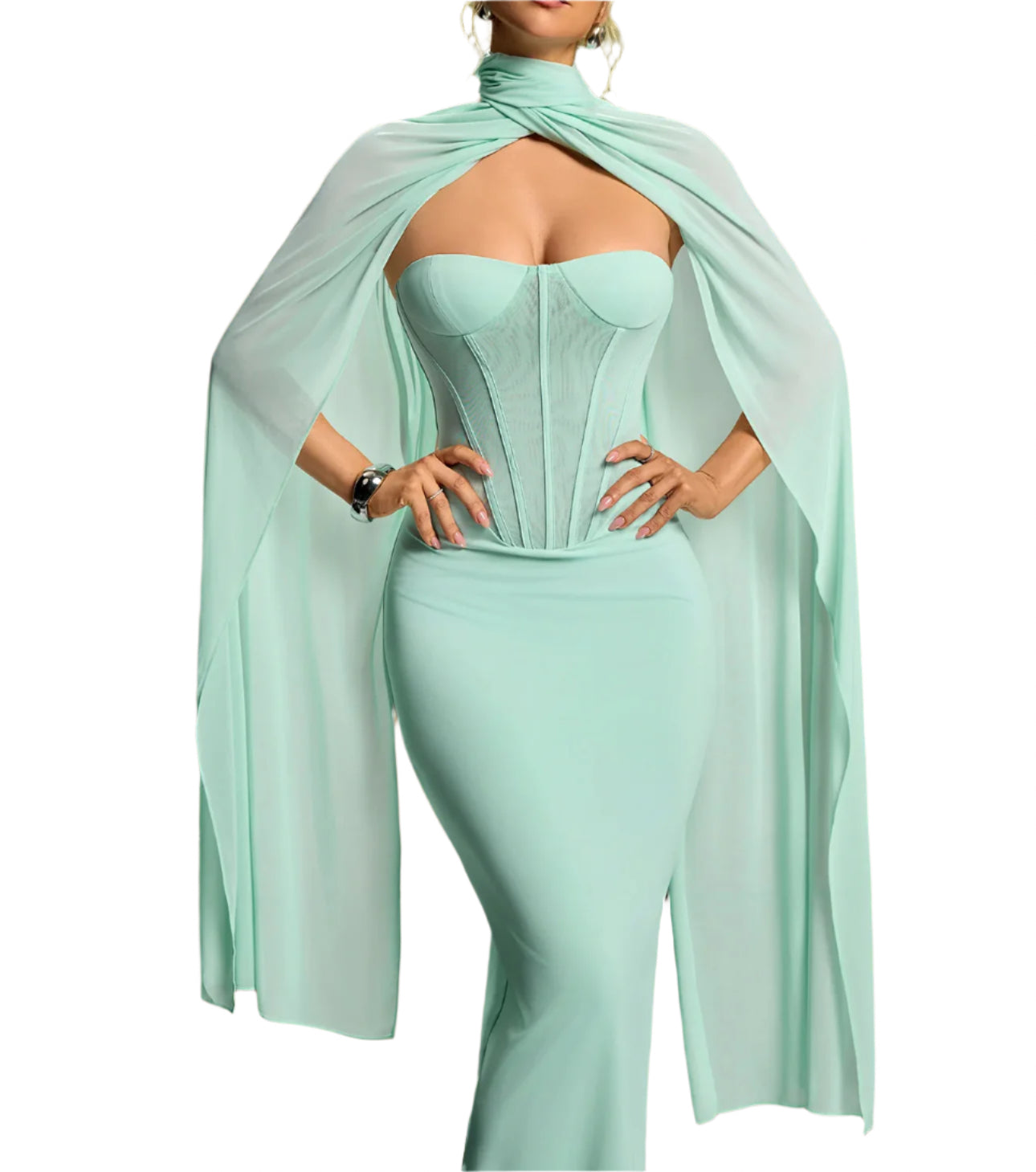 Woman wearing a light blue dress with a flowing fabric over her shoulders against a gradient background