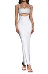 Woman wearing a white dress with a cutout design on a gray background