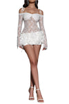 Model wearing a white lace outfit with sheer sleeves on a gray background