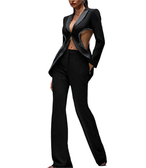 Black suit with cut-out design on a gray background