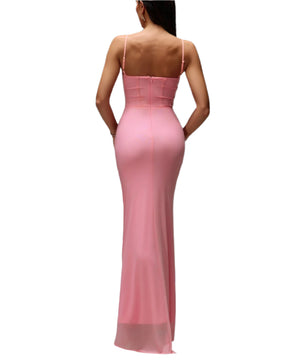 Pink evening gown on a model against a gray background
