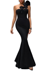 Black evening gown with floral details on a gray background