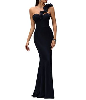 Black evening gown with floral details on a gray background