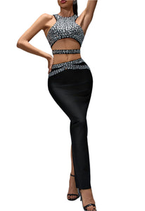 Woman wearing a sparkling top and black pants on a gray background