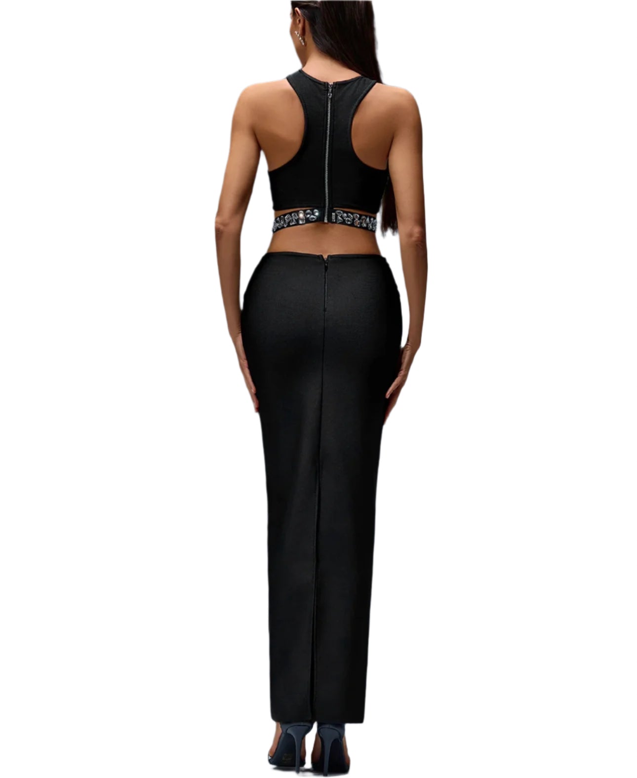 Person wearing a black outfit with a high back on a gray background
