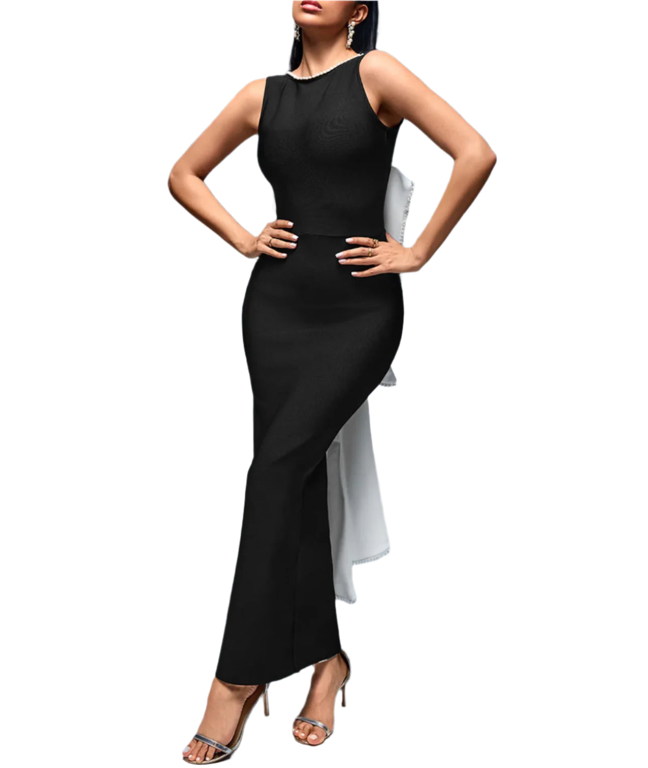 Woman wearing a black sleeveless dress with a white underlayer on a gray background