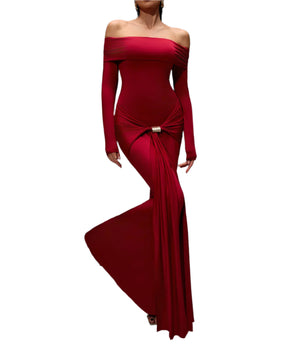 Red off-shoulder gown with long sleeves on a gray background