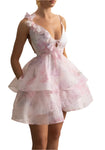 Woman wearing a pink floral dress in an elegant interior setting